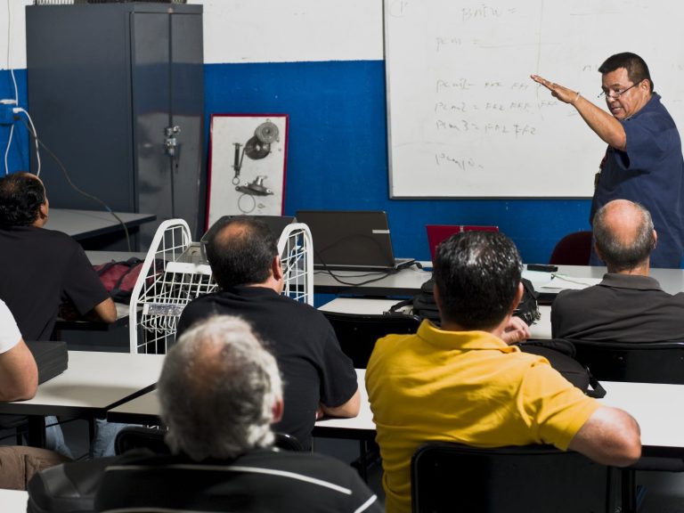 picture of a teacher in front of a classroom 